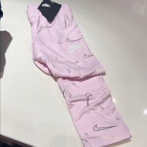 Nike Light Pink Leggings with Swoosh Pattern
